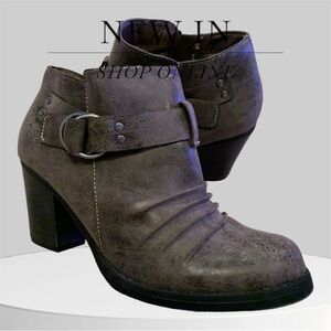Woman’s grey ankle boots